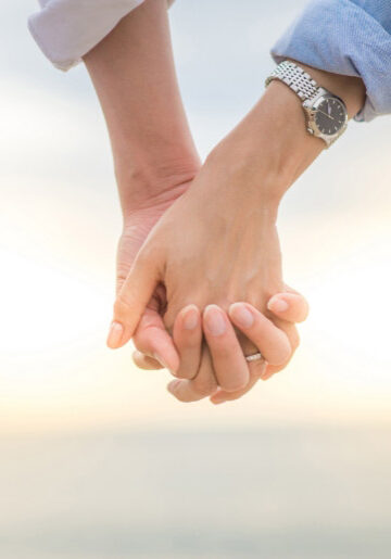 Couple holding hands
